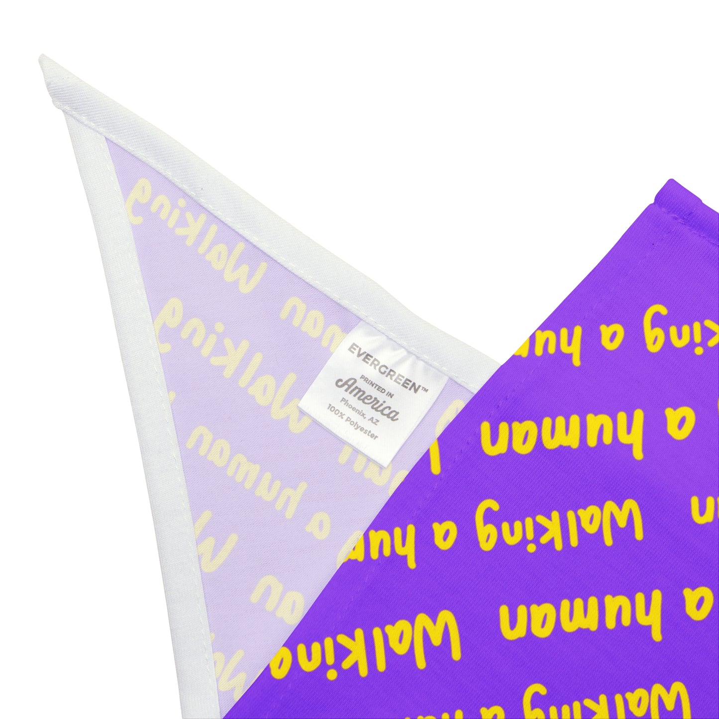 purple "walking a human" repeating text bandana on a dog