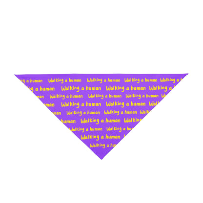 purple "walking a human" repeating text bandana on a dog