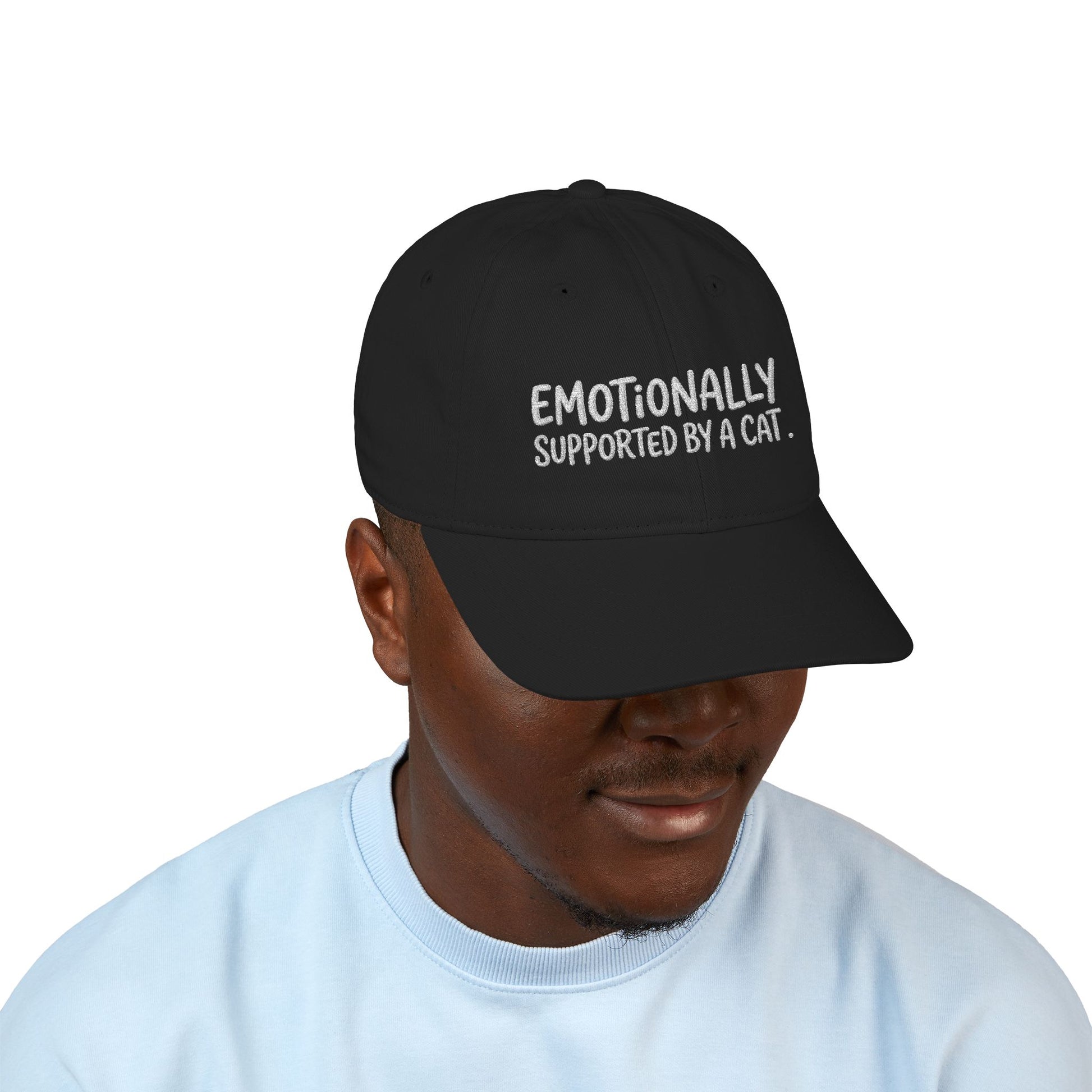 "Emotionally supported by a cat" embroidered organic cotton baseball cap