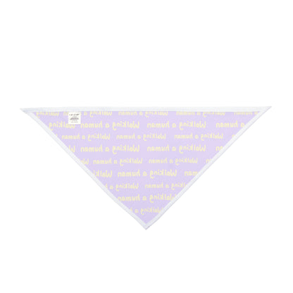 purple "walking a human" repeating text bandana on a dog