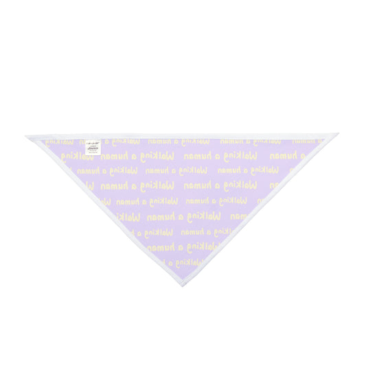 purple "walking a human" repeating text bandana on a dog