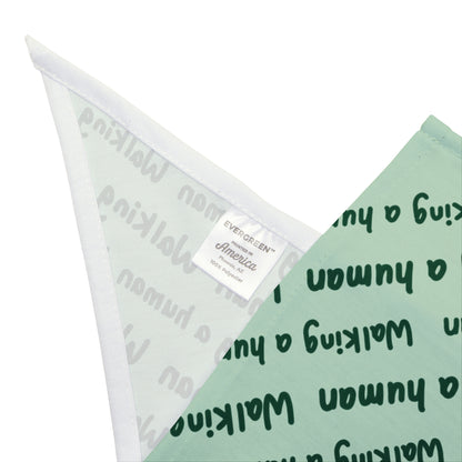 mint "walking a human" repeating text bandana on a dog