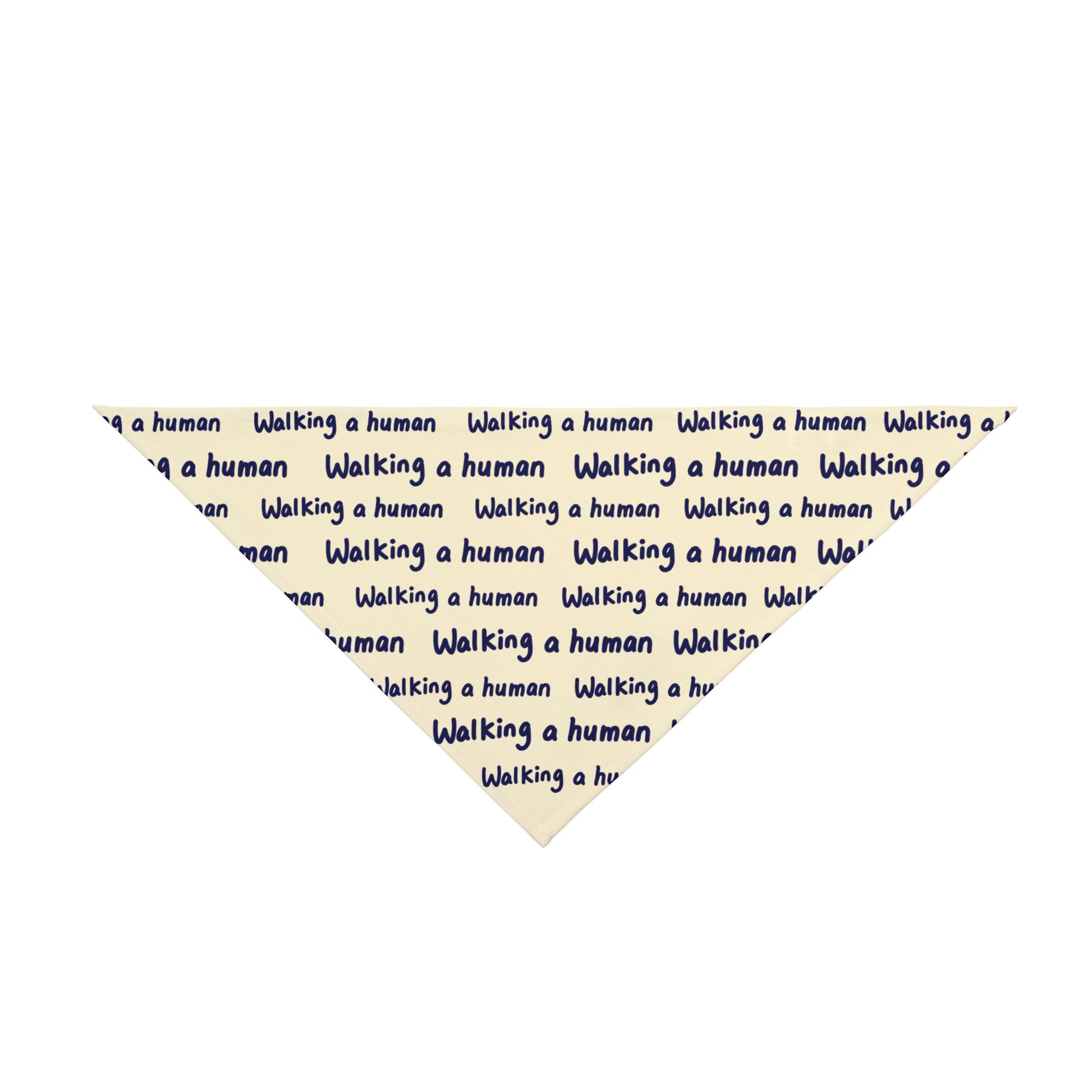 beige "walking a human" repeating text bandana on a small dog