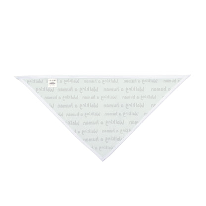 mint "walking a human" repeating text bandana on a dog