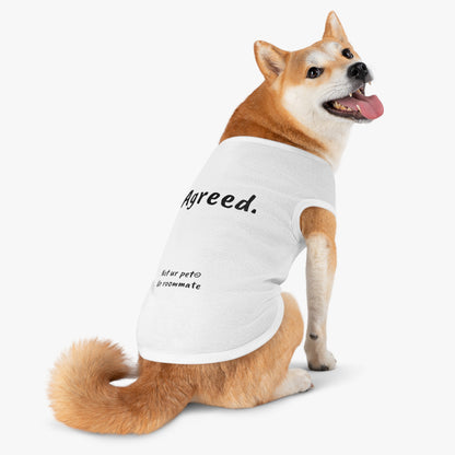 dog wearing t-shirt with "agreed." text on white background