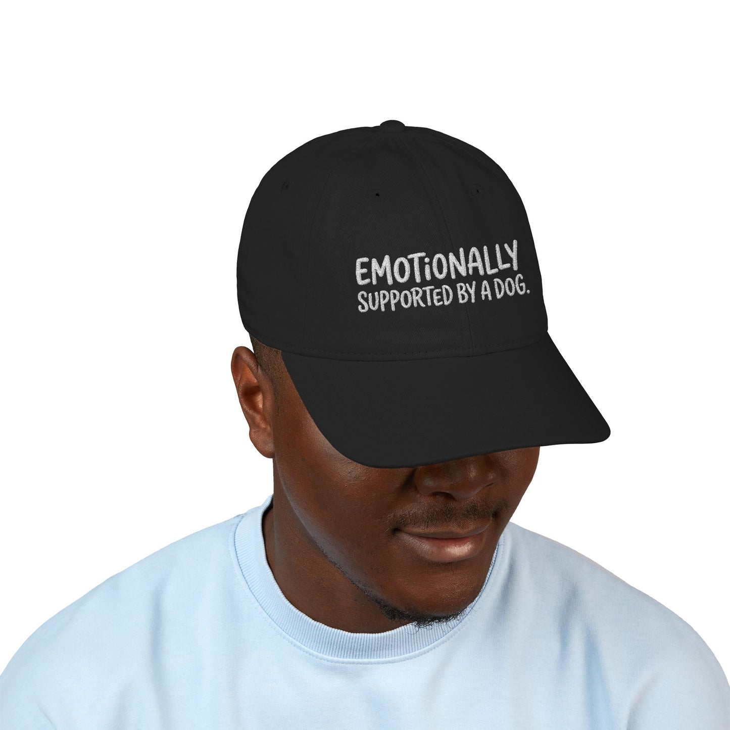 "Emotionally supported by a dog" embroidered organic cotton baseball cap