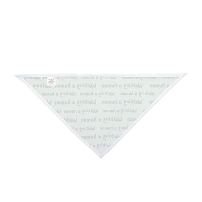 mint "walking a human" repeating text bandana on a dog