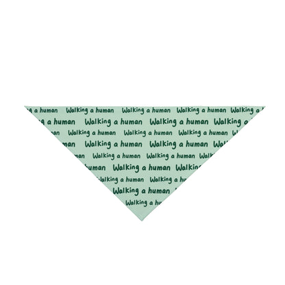 mint "walking a human" repeating text bandana on a dog