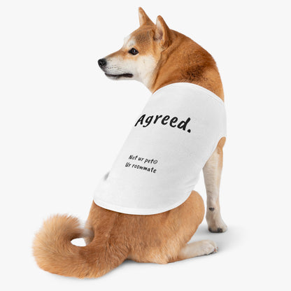 dog wearing t-shirt with "agreed." text on white background