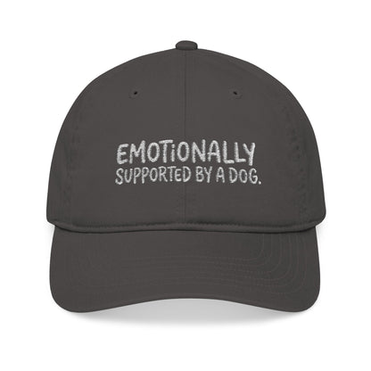 "Emotionally supported by a dog" embroidered organic cotton baseball cap