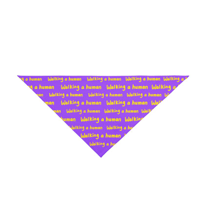 purple "walking a human" repeating text bandana on a dog