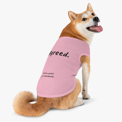 dog wearing t-shirt with "agreed." text on white background